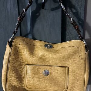 Coach cream color w/ Brown leather strap
Grey lining 
Used 
Excellent condition